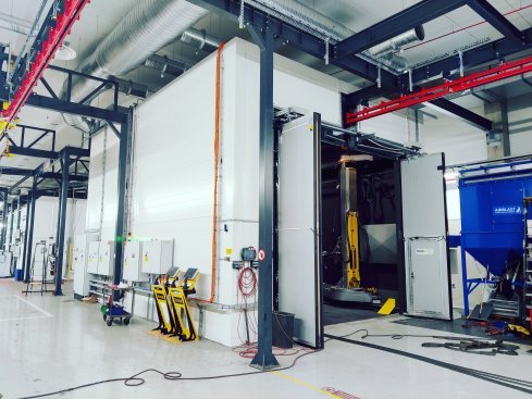 Blastman solution is full automated pass-through blasting chamber.