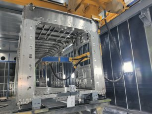 Blast cleaning robot installed to blast clean passenger coach surfaces interior and exterior