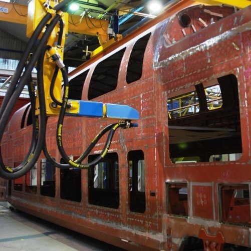 Blast cleaning robot blasting passenger coahes